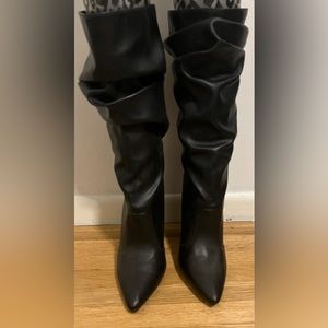 Black boots in size 7.5